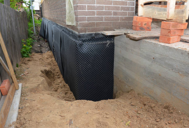 Happy homeowners after waterproofing job in Beltsville